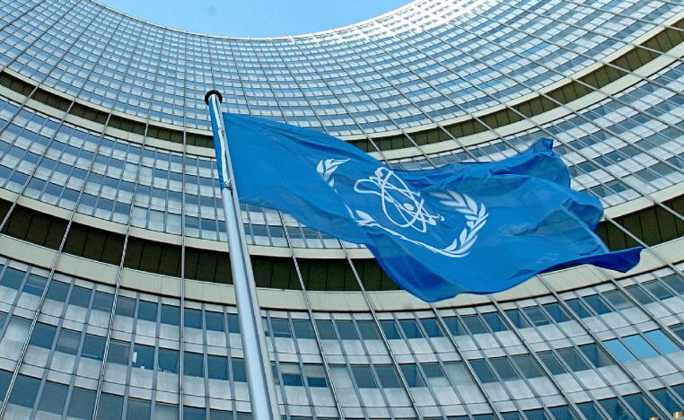 The IAEA flag flatters in the wind in front of the International Atomic Energy Agency headquarters in UN city in Vienna