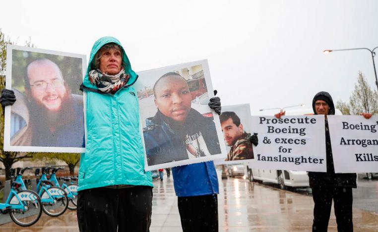 Family and friends of the Ethiopian Airlines Flight 302 Boeing plane crash victims hold a silent protest outside Boeing's annual shareholders meeting