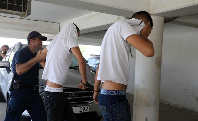 Israeli tourists, suspected of raping a 19-year-old British girl in Ayia Napa, arrive to the court premises with their faces covered in Paralimni