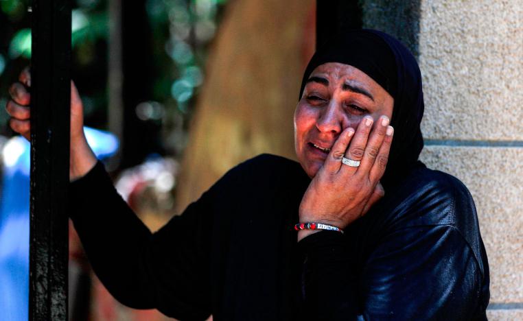 A Palestinian woman of the Siyam family reacts as the family is evicted from their home in the Palestinian neighbourhood of Silwan