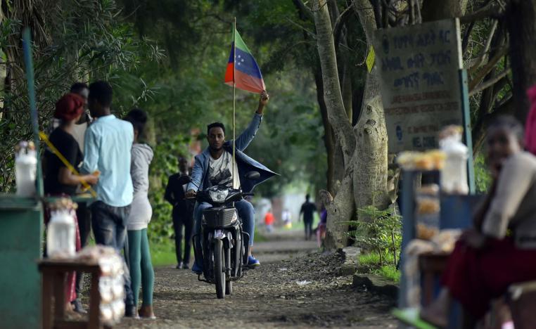 A young man rides a motorcycle along a parkway in Awasa, southern Ethiopia