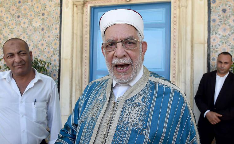 Abdelfattah Mourou (C) arrives to attend the swearing-in ceremony of Tunisia's parliamentary speaker Mohamed Ennaceur as interim president