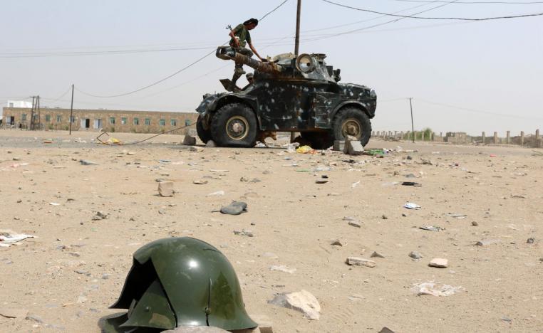 A Fighter with the UAE-trained Security Belt Forces loyal to the pro-independence Southern Transitional Council (STC), stands atop a military vehicle 