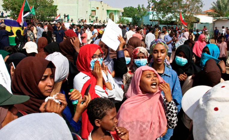 Sudanese protesters chant slogans as they take part in a demonstration called for by the Sudanese Professionals Association