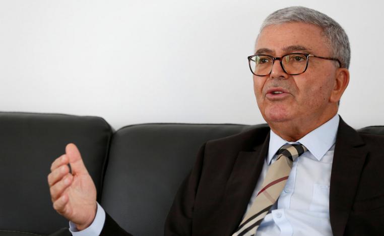 Tunisian Minister of Defense Abdelkarim Zbidi, an independent candidate in the upcoming presidential elections race, gestures during an interview with Reuters in Tunis