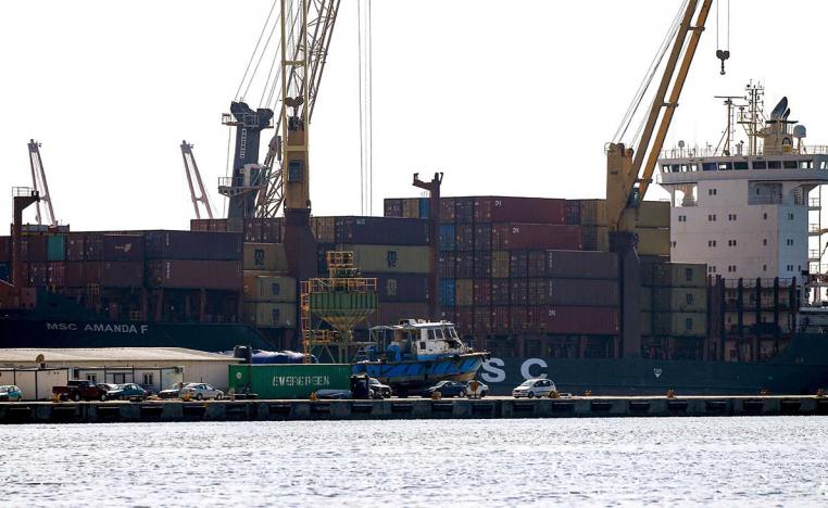 A container ship moored in the harbour of the eastern Libyan port city of Benghazi