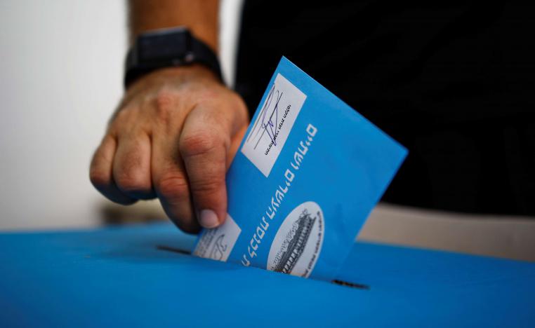 A man votes a poling station in Rosh Haayin, Israel
