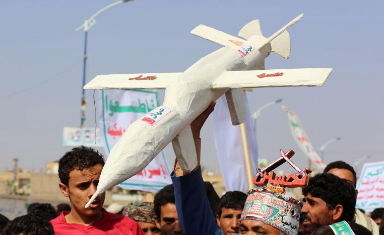 Followers of the Huthi movement carry a mock drone during a rally held to mark Ashura in Saada, Yemen