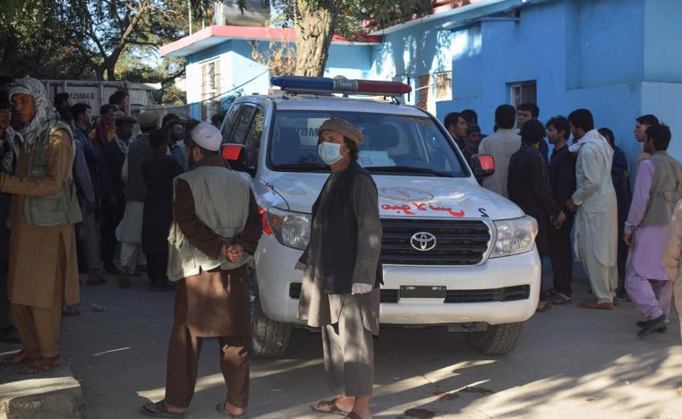 Relatives of Afghan victims arrive outside a hospital, after a suicide attack that targeted a campaign rally for Afghan President Ashraf Ghani