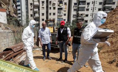Forensic investigators of Lebanon's military intelligence inspecting the scene where two drones came down in the vicinity of a Hezbollah media centre last month