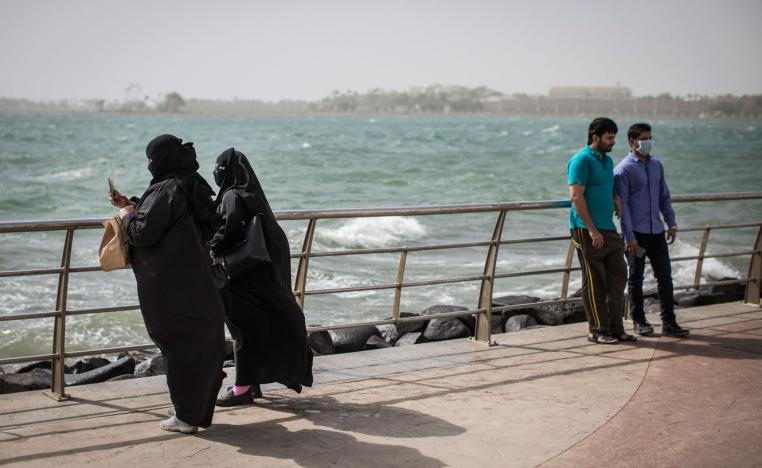 Saudi Arabian women take a picture at the corniche in Jeddah