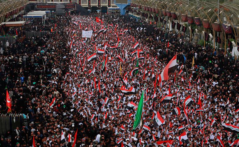 Followers of Shia cleric Moqtada Al Sadr chant slogans against corruption in Karbala, Iraq