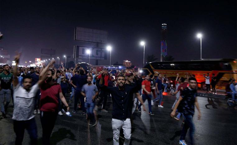 Egyptian protesters shout slogans as they take part in a protest calling for the removal of President Abdel Fattah al-Sisi in Cairo's downtown on September 20