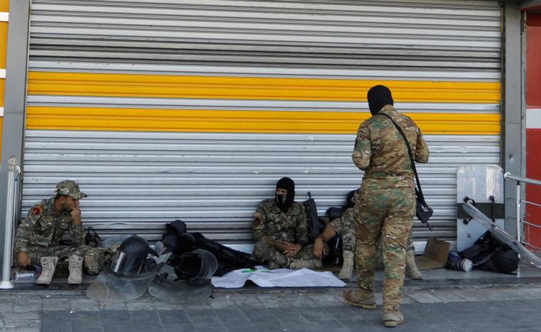 Iraqi security forces pictured in Tahrir square after the lifting of the curfew