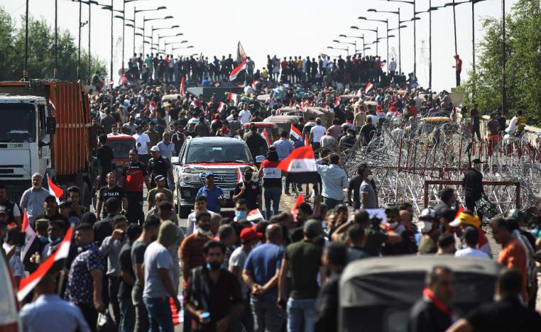 Iraqi protesters gather on the capital Baghdad's Al-Jumhuriyah Bridge