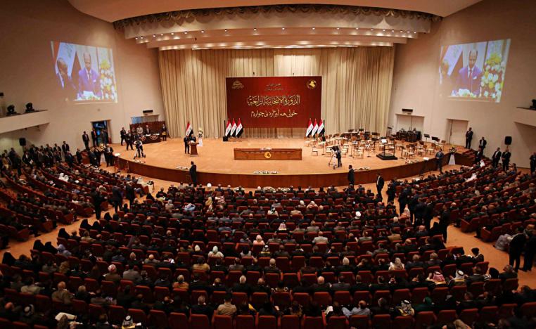 Iraqi lawmakers attend a parliament session in Baghdad, Iraq