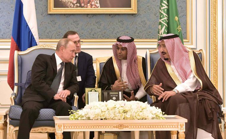 Russian President Vladimir Putin (L) and Saudi King Salman bin Abdulaziz Al Saud attend a meeting in Riyadh