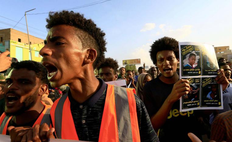 Sudanese protesters chant slogans during a rally calling for the former ruling party to be dissolved and for ex-officials to be put on trial in Khartoum