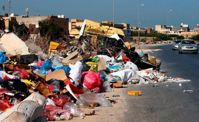 A view of rubbish piling up along the side of a street in the Libyan capital Tripoli