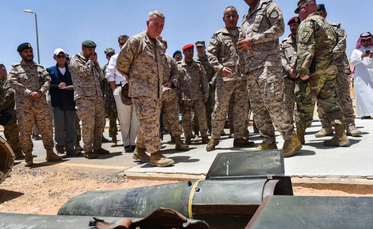 US Marine Corps General Kenneth F. McKenzie Jr. (7th-L), commander of the US Central Command (CENTCOM), is shown alleged Iranian weapons seized by Saudi forces from Yemen's Huthi rebels