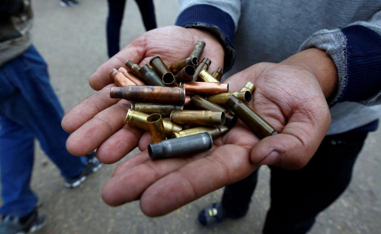 A man shows the casings from bullets which were used against protesters in Najaf