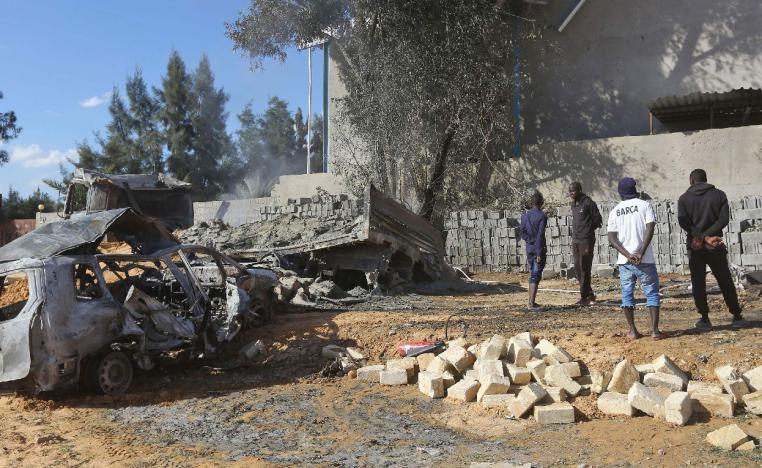 Aftermath of a reported air strike on a factory south of the Libyan capital Tripoli