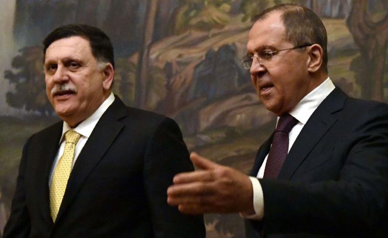 2017 file picture shows Russian Foreign Minister Sergei Lavrov (R) and head of the Tripoli-based Presidential Council Fayez al-Sarraj