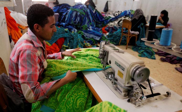 A labourer works at a textile mill in Al-Mahalla al-Kubra, Egypt