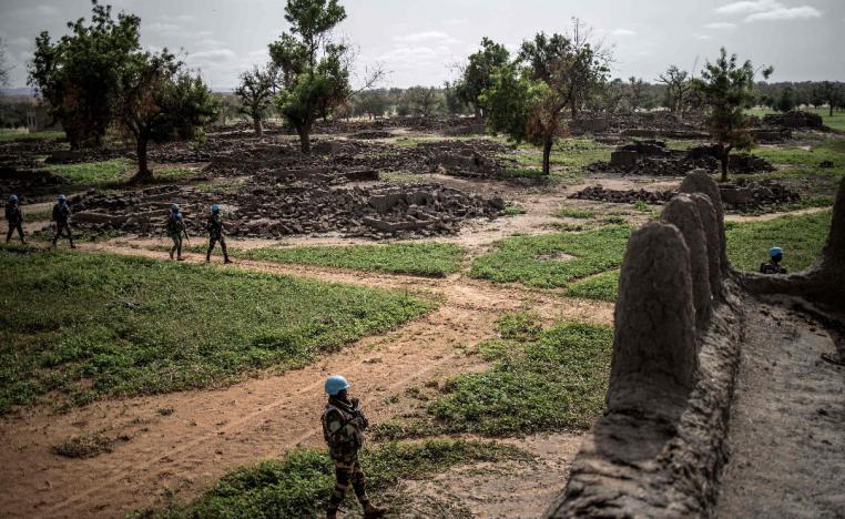 UN foot soldiers patrol in the destroyed Fulani village of Sadia-Peulh