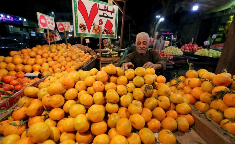 An Egyptian fruit seller is seen at a market in Cairo