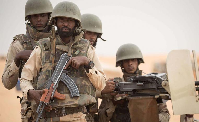 Mauritanian soldiers stand guard at a G5 Sahel task force command post