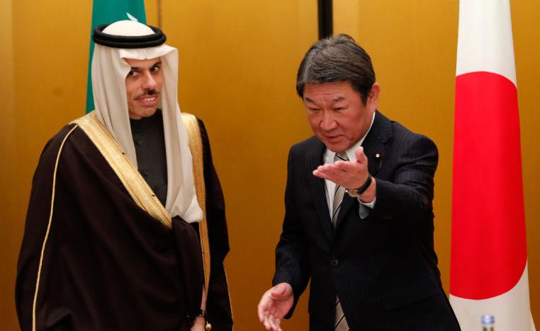 Japanese Foreign Minister Toshimitsu Motegi shows the way to Saudi Arabia's counterpart Prince Faisal bin Farhan at a bilateral meeting during the G20 Foreign Ministers meeting in Nagoya