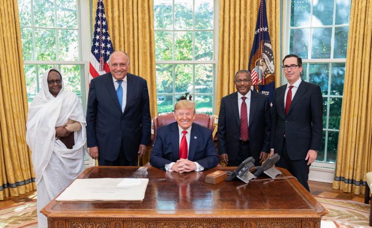 US President Donald Trump (C) poses for a picture with Sudanese Minister of Foreign Affairs Asma Mohamed Abdalla (L), Egyptian Minister of Foreign Affairs Sameh Shoukry (2nd L), Ethiopian Minister of Foreign Affairs Gedu Andargachew (2nd R), and US Secretary of the Treasury Steven Mnuchin (R)