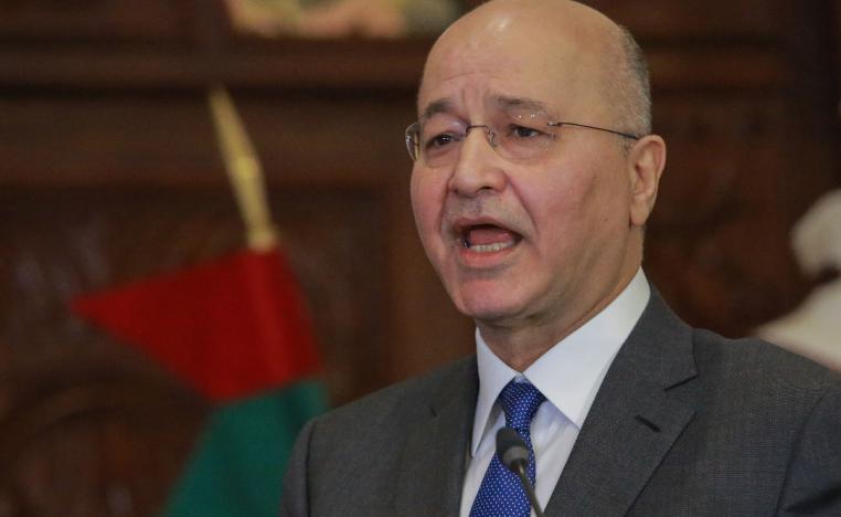 Iraqi President Barham Salih speaks during a press conference