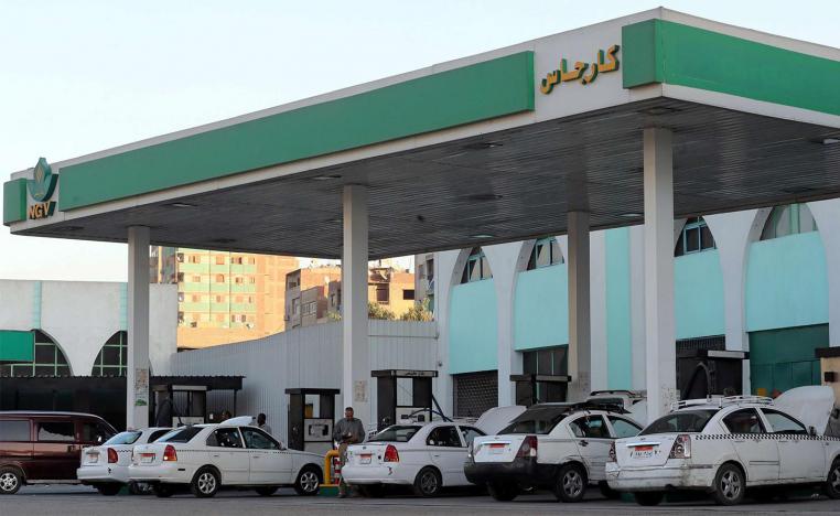 Taxis and cars are filled up with gas at Natural Gas Vehicles (NGV) petrol station in Cairo