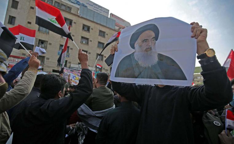 Iraqi supporters of Iran-backed Hashed Al-shaabi armed network protest in Baghdad's Tahrir Square