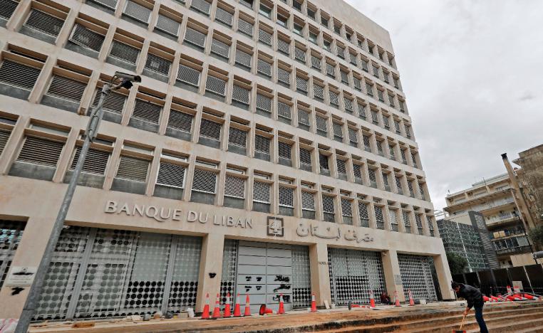 Workers carry out renovation outside the headquarters of the Lebanese Central Bank in Beirut