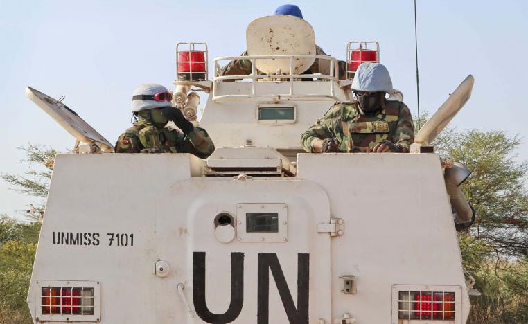 UN peacekeepers in an armored personnel carrier lead a patrol from Bentiu towards the village of Nhialdiu