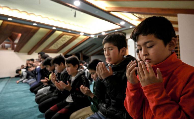 Uighur students pray after lessons on November 29, 2019 at Silivri district in Istanbul