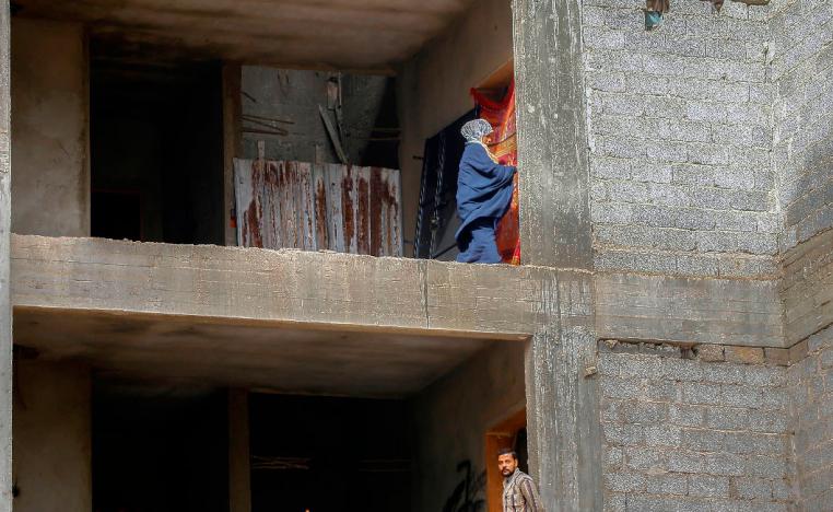Displaced Libyans are pictured in an unfinished building in the Libyan capital Tripoli