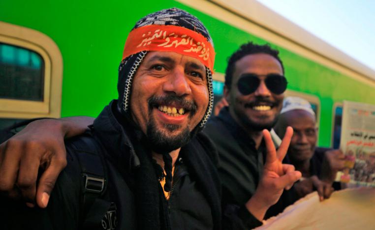 Sudanese people take to the streets on December 19, 2019 to celebrate the one-year anniversary of their protest movement