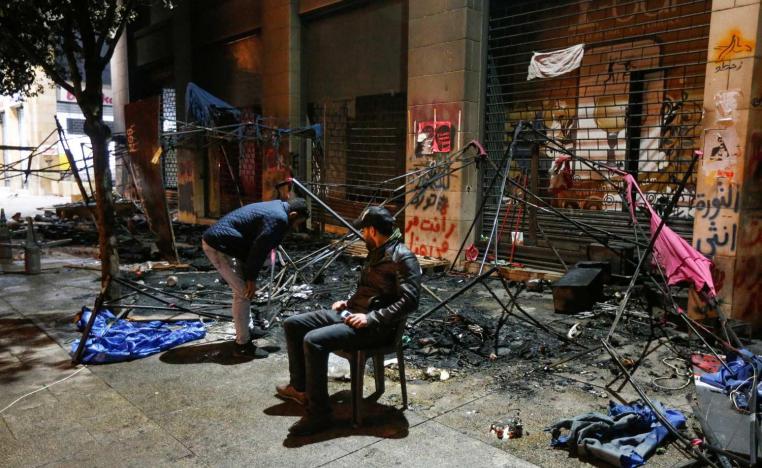 The violence began after dozens of protesters threw rocks and large plant pots at police