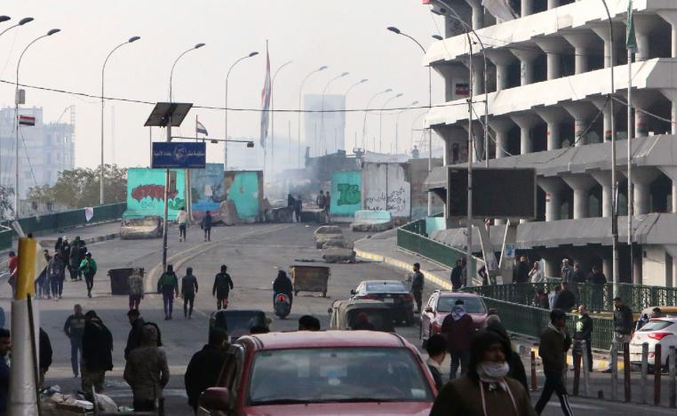 Iraqi anti-government protesters gather at al-Sinek bridge in the capital Baghdad