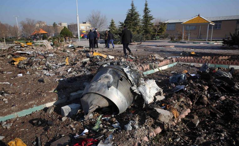 Rescue teams work amidst debris after a Ukrainian plane carrying 176 passengers crashed near Imam Khomeini airport in the Iranian capital Tehran 