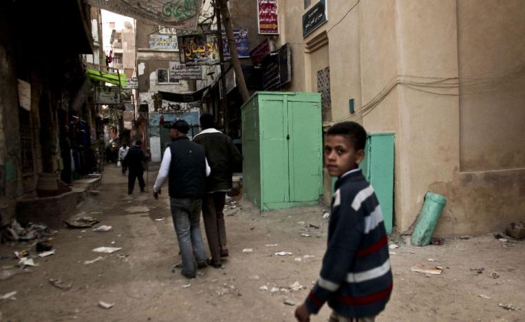 2012 photo shows a kiosk, center, used as a clinic where girls are circumcised by a barber in Giza, Egypt