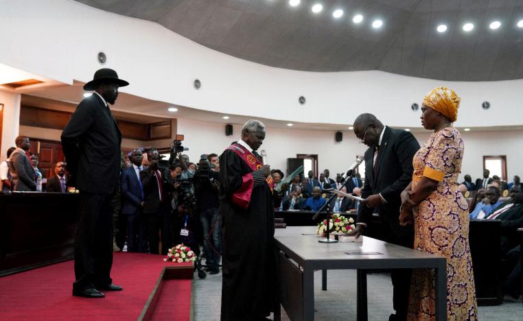 South Sudan's First Vice President Riek Machar takes the oath of office in front of President Salva Kiir