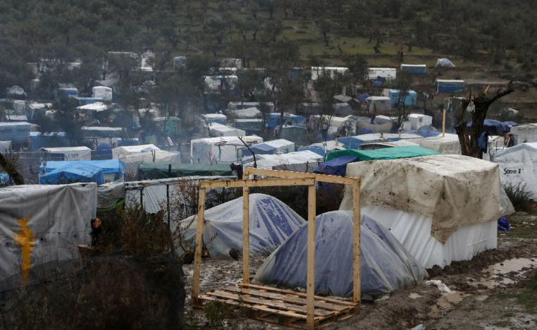 A view of temporary camp for refugees and migrants next to the Moria camp during heavy rainfall on the island of Lesbos