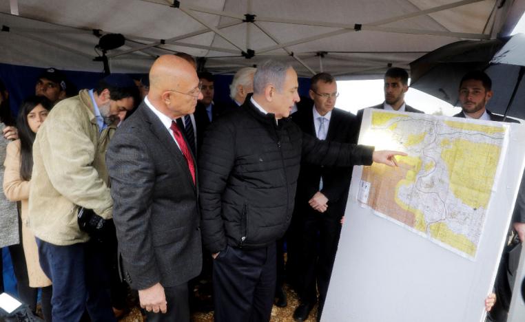 Israeli Prime Minister Benjamin Netanyahu checks the area map during his visit to Ariel settlement in the West Bank