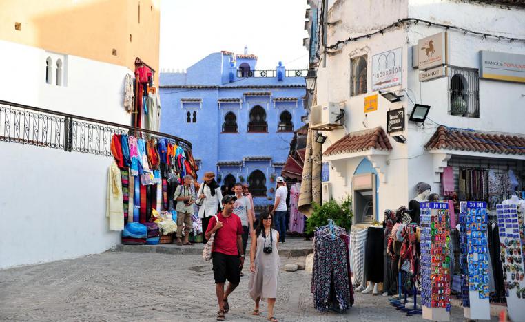 Tourists wandering in the streets of Chefchaouen