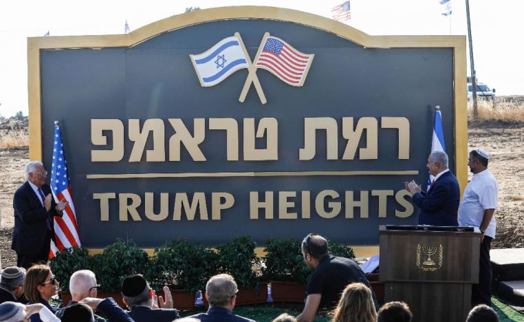 Israeli Prime Minister Benjamin Netanyahu (2nd-R) and US Ambassador to Israel David Friedman (L) applaud after unveiling the place-name sign for the new settlement of "Ramat Trump" or "Trump Heights"